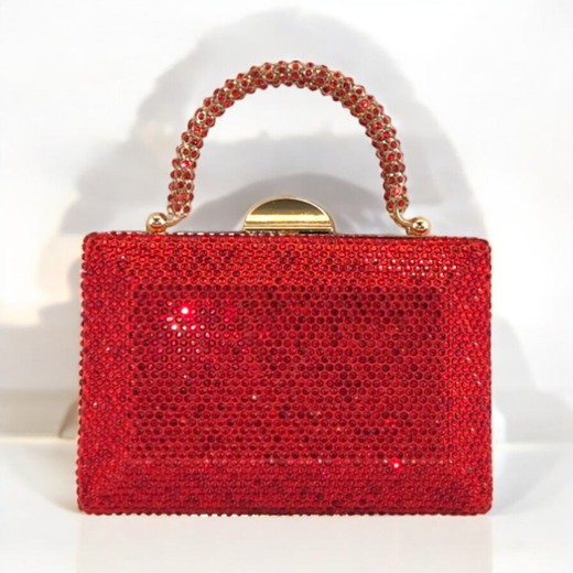 Bolso de mano en rojo brillante con cristales y asa de lujo