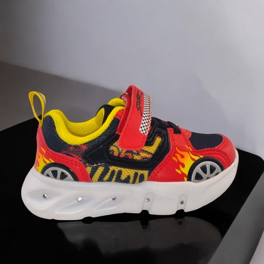 Zapatilla infantil deportiva roja con luces y diseño de llamas