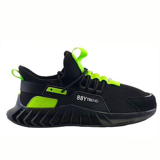 Zapato deportivo color negro con detalles verdes fluorescentes hombre